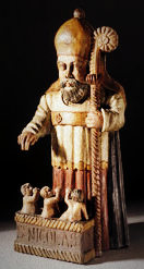A statue of St. Nicholas with three children at his feet (based on the legend)
